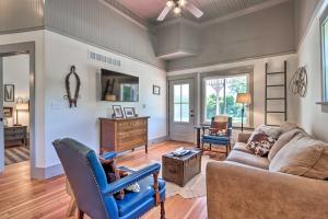 a living room with a couch and a table at The Ruebling House Bright, Modern, and Renovated! in Defiance