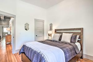 a bedroom with a large bed with a wooden headboard at The Ruebling House Bright, Modern, and Renovated! in Defiance