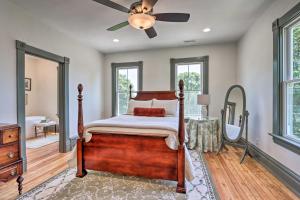 a bedroom with a bed and a ceiling fan at The Ruebling House Cozy Defiance Apartment! in Defiance