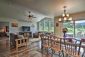 a dining room and living room with a table and chairs at Estes Park Mountain-View Retreat 3 Miles to RMNP! in Estes Park