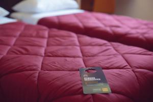 Uma cama ou camas num quarto em Premiere Classe Roissy Aéroport Charles De Gaulle