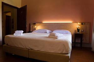 Voodi või voodid majutusasutuse Paradiso in Chianti toas