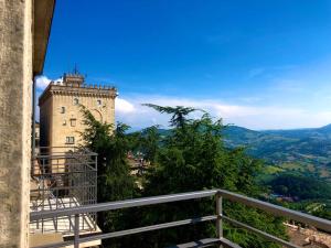 a castle on top of a hill with a view at Hotel Bellavista in San Marino