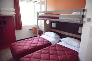 Uma cama ou camas num quarto em Premiere Classe Roissy Aéroport Charles De Gaulle