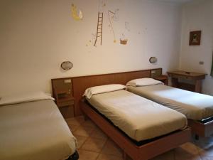 Letto o letti in una camera di Hotel Daniela