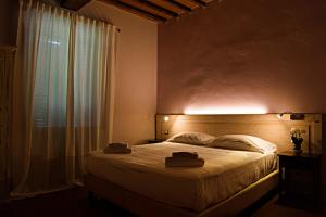 Voodi või voodid majutusasutuse Paradiso in Chianti toas