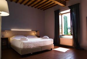Voodi või voodid majutusasutuse Paradiso in Chianti toas