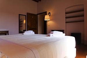 Voodi või voodid majutusasutuse Paradiso in Chianti toas