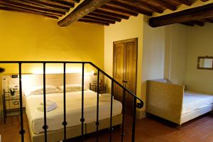 Voodi või voodid majutusasutuse Paradiso in Chianti toas