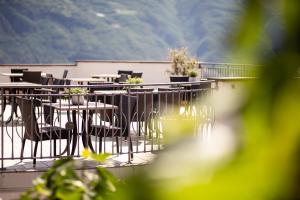 a group of tables and chairs on a patio at Ebnerhof in Appiano sulla Strada del Vino
