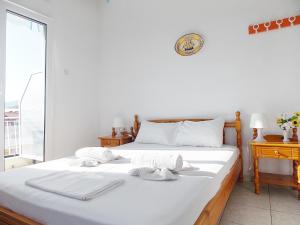 Postel nebo postele na pokoji v ubytování Hotel Sgouridis