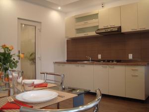 a kitchen with a table with a plate on it at Casa cu Flori in Buşteni +92 photos