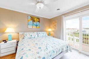 a bedroom with a bed and a window at Lucayan 27 in Ocean City