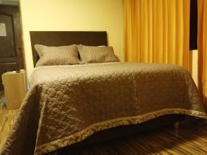 Postel nebo postele na pokoji v ubytování Hostal Inca