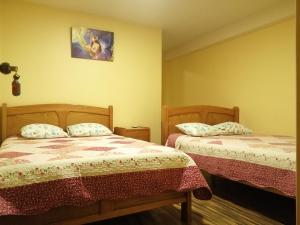 Postel nebo postele na pokoji v ubytování Hostal Inca