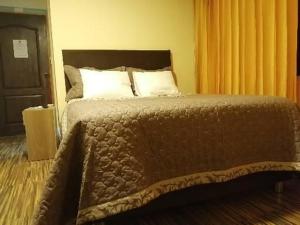 Postel nebo postele na pokoji v ubytování Hostal Inca