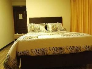 Postel nebo postele na pokoji v ubytování Hostal Inca
