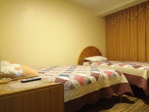 Postel nebo postele na pokoji v ubytování Hostal Inca