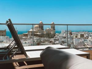 a balcony with a view of a city at Skyline - Penthouse with 50m2 private terrace and stunning views in Cádiz