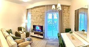 TV a/nebo společenská místnost v ubytování Apartment Pupa