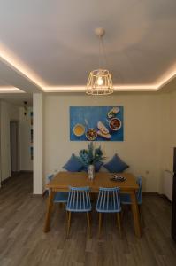 a dining room with a table and two chairs at L & A - GUEST HOUSE in Skala Potamias