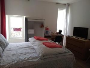 Postel nebo postele na pokoji v ubytování L'Auberge Chez Pascal