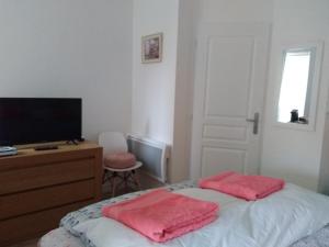 Postel nebo postele na pokoji v ubytování L'Auberge Chez Pascal