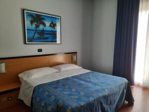 Un pat sau paturi într-o cameră la Hotel La Terrazza
