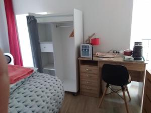 Postel nebo postele na pokoji v ubytování L'Auberge Chez Pascal