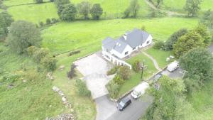 an aerial view of a large house in a field at Bluebell - House in Manorhamilton