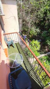 a balcony with a table and a chair on a porch at Apartments Vjeko in Split +25 photos