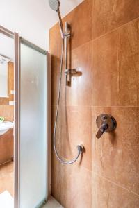 a shower with a glass door in a bathroom at Luxury Apartment Set in Split