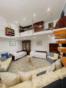 a large living room with a couch and a table at Coco's Apartment in Meta