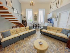a living room with two couches and a table at Coco's Apartment in Meta