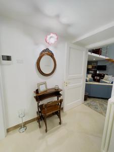 a room with a table and a mirror on the wall at Coco's Apartment in Meta