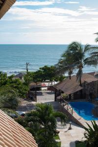 a view of the ocean from the balcony of a resort at Pousada Mundial in Canoa Quebrada