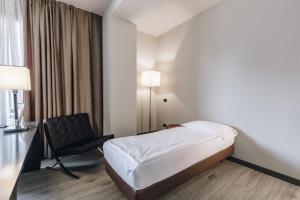 Postel nebo postele na pokoji v ubytování Hotel Continental