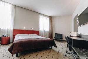 Postel nebo postele na pokoji v ubytování Hotel Continental