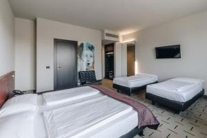 Postel nebo postele na pokoji v ubytování Hotel Continental