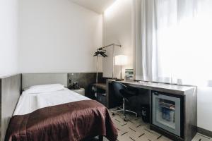 Postel nebo postele na pokoji v ubytování Hotel Continental