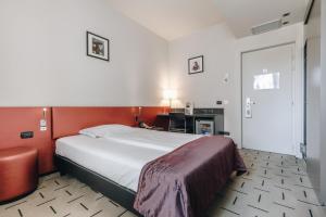 Postel nebo postele na pokoji v ubytování Hotel Continental