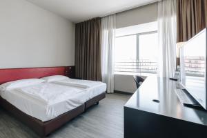 Postel nebo postele na pokoji v ubytování Hotel Continental