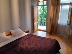 Кровать или кровати в номере Andranik B&B 