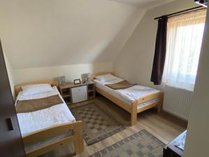 Postel nebo postele na pokoji v ubytování Grádics Panzió