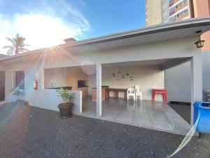 an open patio with a table and chairs at Dallas Hotel in Palotina