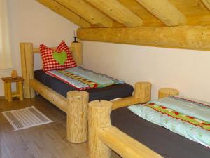 Postel nebo postele na pokoji v ubytování C.T.N. Loghouse