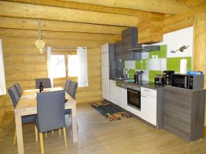 A kitchen or kitchenette at C.T.N. Loghouse