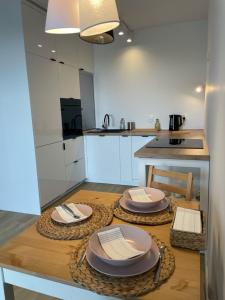 Kuchyňa alebo kuchynka v ubytovaní Apartament Słoneczna Zatoka