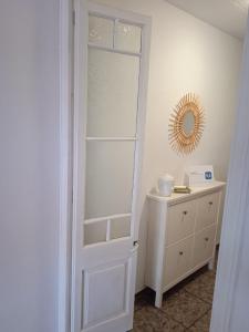a white door in a room with a dresser at Casa Olivera- apartament al Passeig Font Vella in Sant Hilari Sacalm