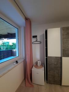 Kuchyň nebo kuchyňský kout v ubytování Rooms Optim
